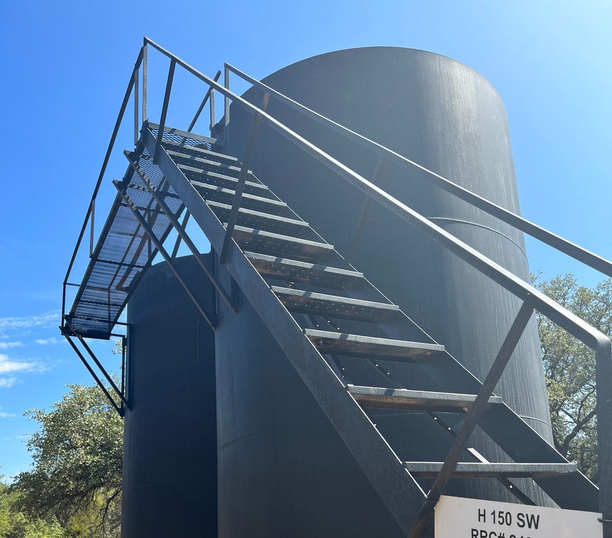 Storage tank with a steel stairway